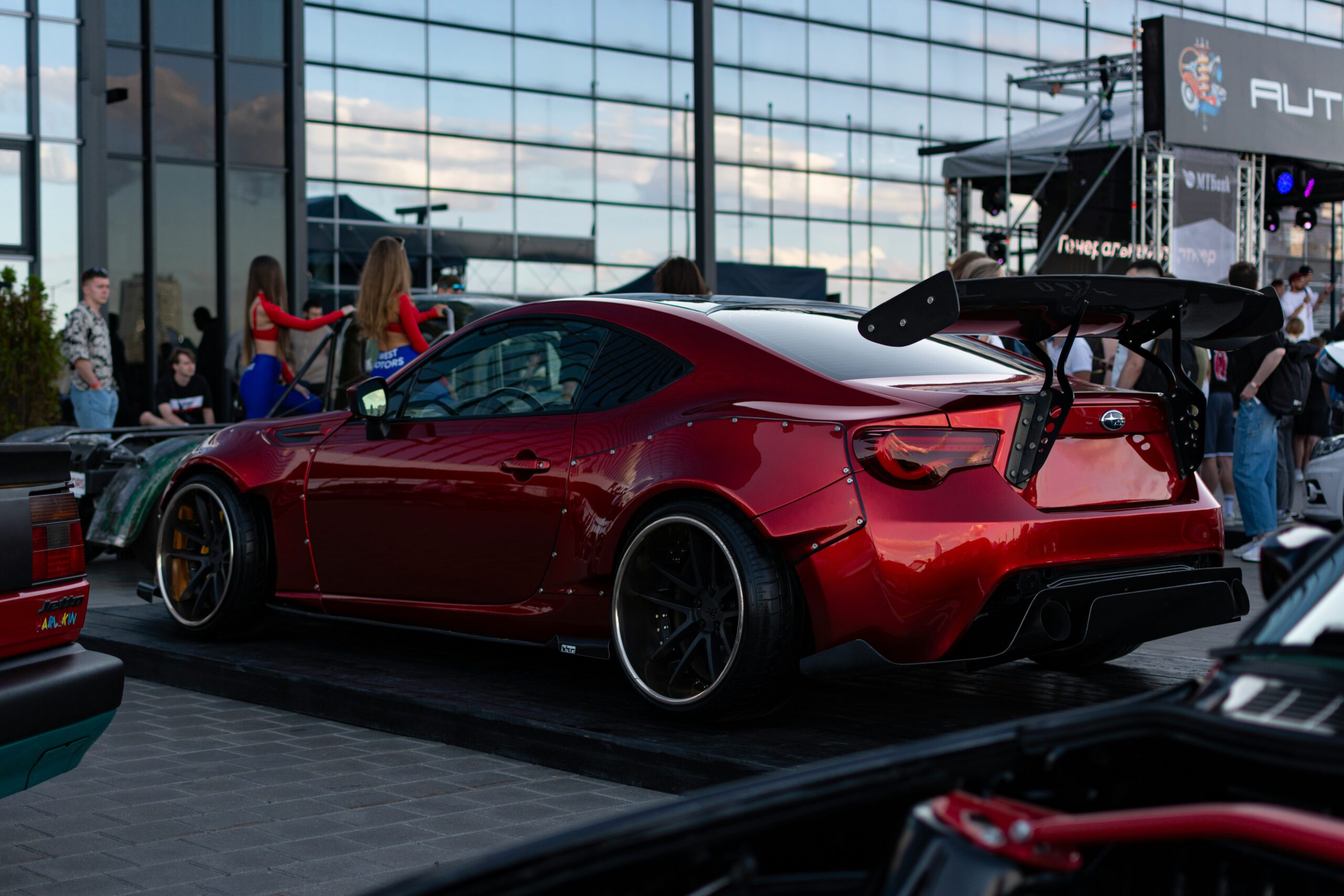 a red sports car parked in front of a building